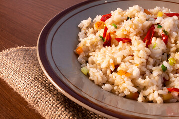 simple fried rice served on a plate on burlap