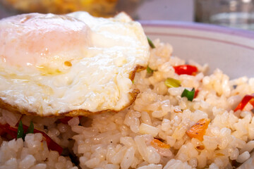 fried rice with omelet traditional indonesian food close up photo