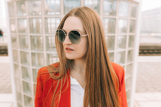 Portrait of a long haired woman in sunglasses 
