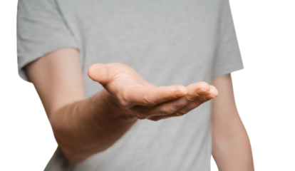 A man in a gray T-shirt holds out his hand to the camera, palm up. Male silhouette isolate on white background. Showing his hand to the camera.