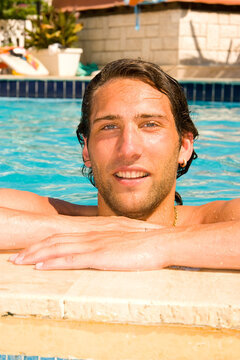 attractive young man in the swimmingpool