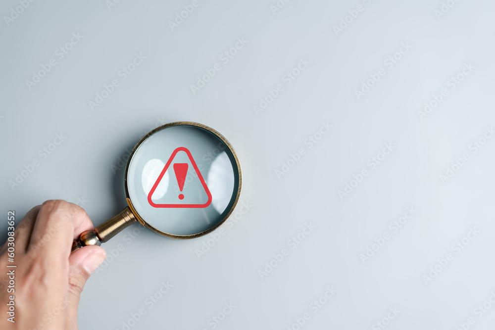 Aufkleber System warning caution sign inside magnifier for notification error and maintenance. cyber attack on computer network. data breach, illegal connection, compromised information.