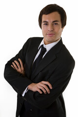 portrait of a confident handsome brunette young business man wearing business suit