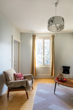 Classic small french apartment with big window, comfortable armchair