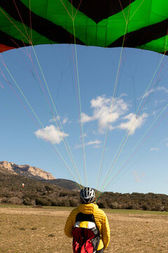 man practicing paragliding wing ground Control 