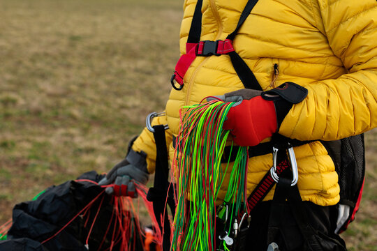 man holdings parachute strings 