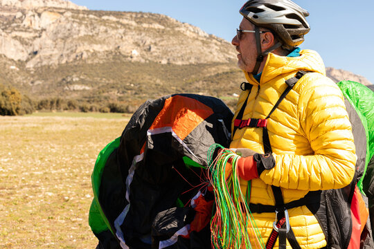 man  holding a parachute 