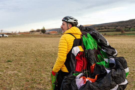 man holding a parachute 