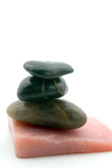 handmade soap and pebbles isolated on white