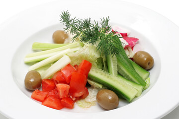 Obraz na płótnie Canvas Vegetables on a plate isolated over white.