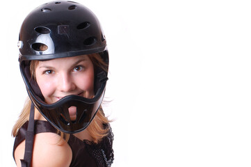 Close-up portrait of blonde girl in black helmet isolated on white
