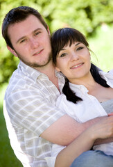 Fototapeta premium happy loving couple together relaxing in garden