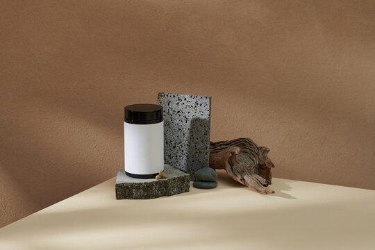White jar with natural medicinal supplement on a podium