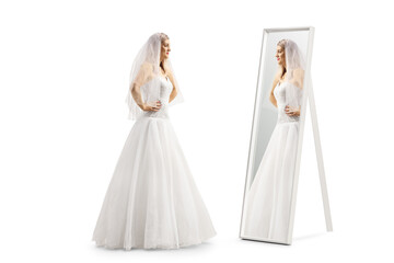 Full length profile shot of a bride standing in front of a mirror
