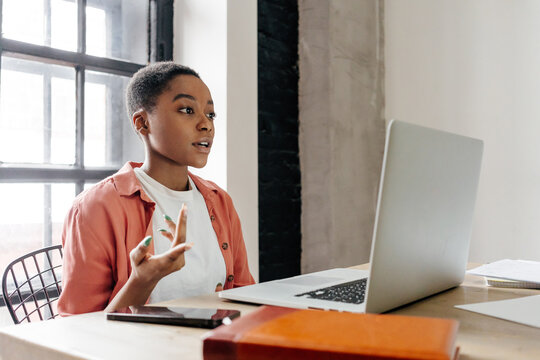 Black woman leading webinar on laptop