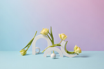 Abstract composition of concrete props and tulips.