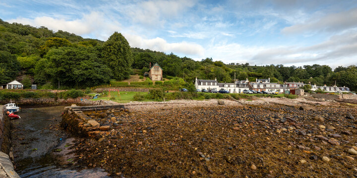 Low tide at Corrie Port, a small harbour in the pretty seaside village of Corrie on the Isle of Arran, Scotland.
