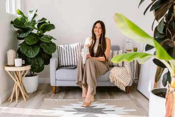 Happy elegant businesswoman at cosy office
