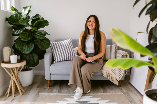 Smiling Latin Businesswoman At Comfy Office