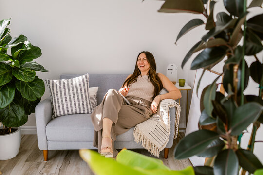 Joyful relaxed businesswoman at cosy office