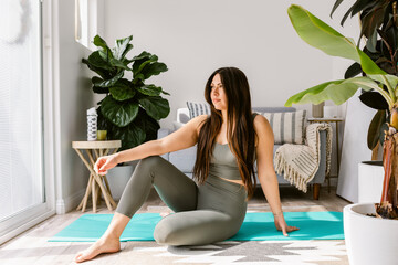 Wellness woman prepared to do yoga at home