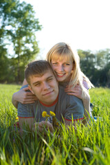Fototapeta premium Happiness couple in love on green grass