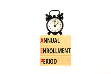 AEP symbol. Concept words AEP Annual enrollment period on beautiful wooden block. Black alarm...
