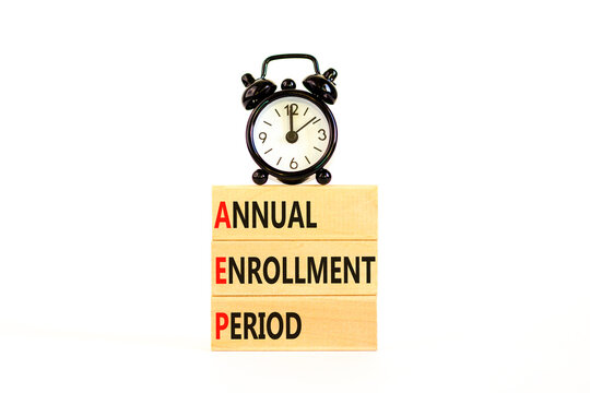 AEP symbol. Concept words AEP Annual enrollment period on beautiful wooden block. Black alarm clock. Beautiful white table white background. Medical AEP Annual enrollment period concept. Copy space.