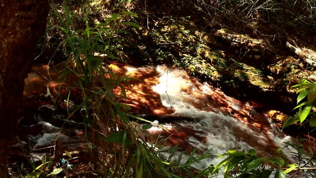 The small river known as Rio dos Goianos that flows into the Waterfall Known as Cachoeira Boqueirao in Paranoa, Brazil, near Brasilia
