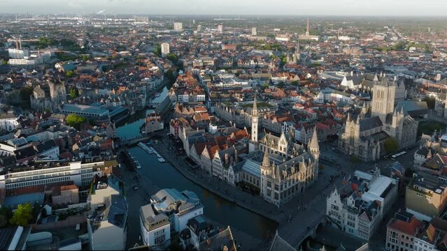 Ghent Belgium Aerial Flying over downtown area with church cityscape views at sunset time - October 2022