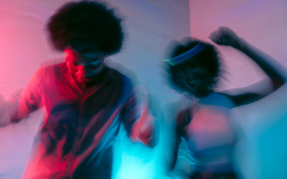 Guy and girl dancing at a home party