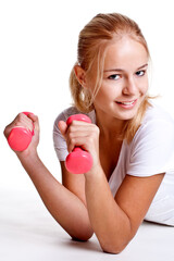 pink dumbbells in the hands of women on a white background