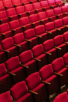Row of red empty seats in auditorium