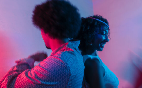 Guy and girl dancing at a home party