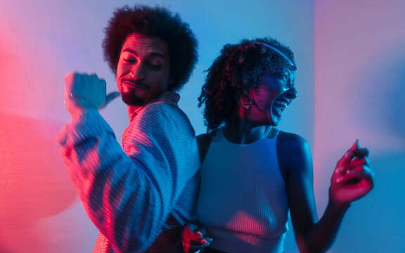 Guy and girl dancing at a home party