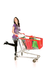Obraz na płótnie Canvas girl with shopping cart over white background