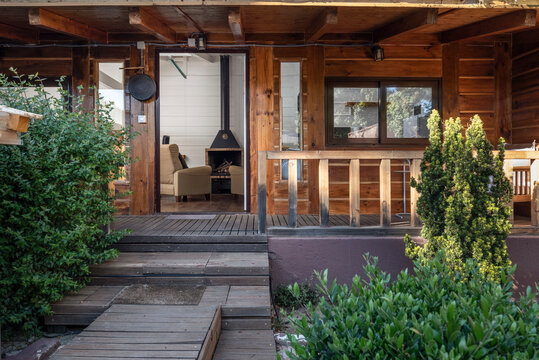 Front view of Wooden country house with wrap-around deck