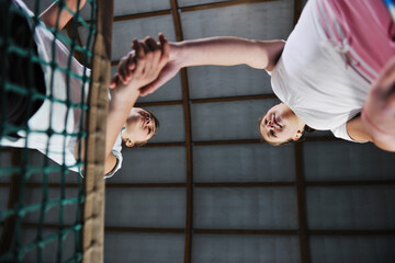 two young girls playing tennis