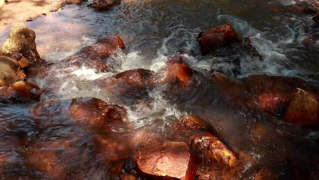 The small river known as Rio dos Goianos that flows into the Waterfall Known as Cachoeira Boqueirao in Paranoa, Brazil, near Brasilia