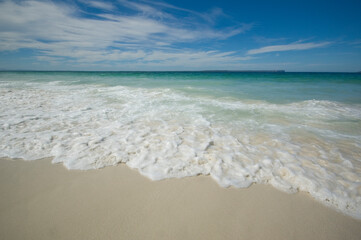 waves crashing on a tropical beach