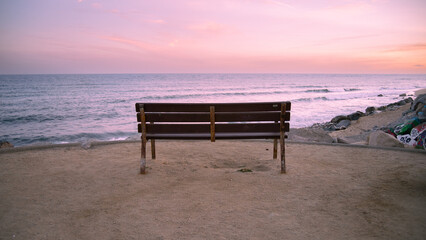Empty bench watching the sunset