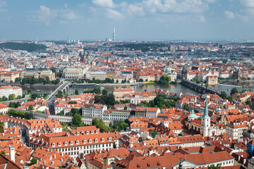 Naklejka na ściany i meble Aerial panoramic view of Prague, with Charles Bridge and other monuments to be recognised.