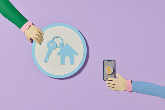 Paper icon of real estate icon and hand hold a phone with money dollar