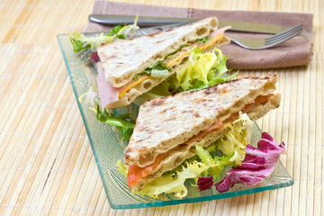 Fototapeta na wymiar healthy smoked salmon and vegetables big sandwich with salad