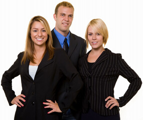 One business man in between two attractive confident business women both wearing dark colored business suits all smiling standing on white background