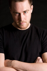 young man portrait on black background