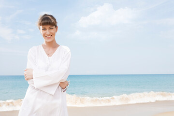 Portrait of nice young woman having good time on the beach