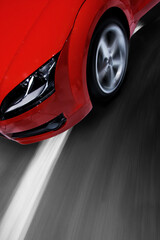 Fast sports car moving with motion blur and zooming effect