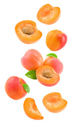 flying apricot fruits with slices and green leaf isolated on white background. clipping path