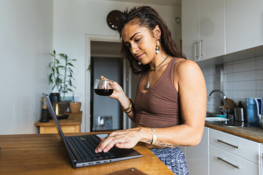 Focused young woman drinking coffee
